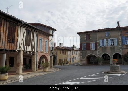 ancient half timbered buildings surround the Halle de Cologne in the bastide of Cologne, Gers, France,Europe Stock Photo