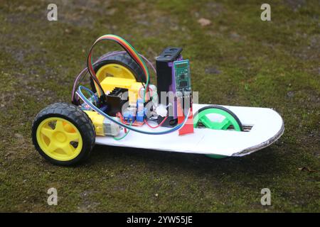 Robotic car that is controlled by bluetooth powered by programmable micro controller. Mobile phone controlled robotic car Stock Photo