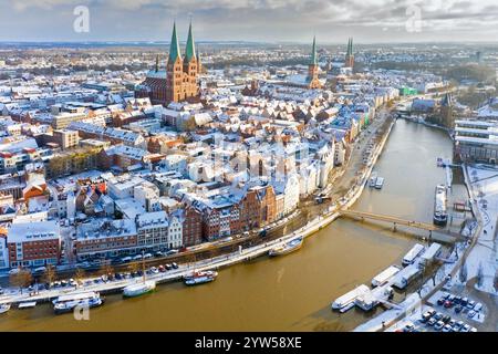 Aerial view over the river Trave and church towers in the old town of the Hanseatic City of Lübeck in winter, Schleswig-Holstein, Germany Stock Photo