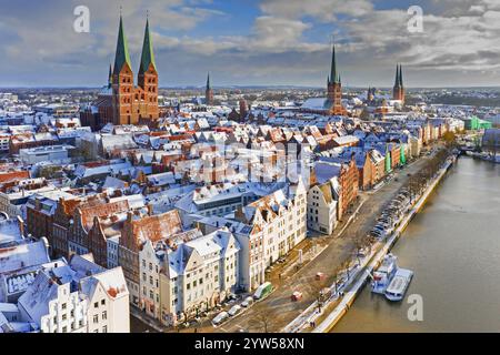 Aerial view over the river Trave and church towers in the old town of the Hanseatic City of Lübeck in winter, Schleswig-Holstein, Germany Stock Photo