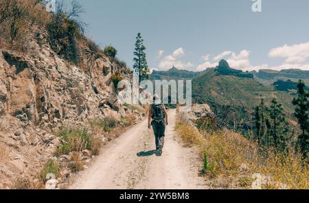 Rear view of female hiker near Artenara on Gran Canaria, Canary Islands, Spain Stock Photo
