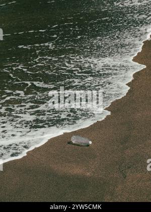 Plastic bottle on beach Stock Photo