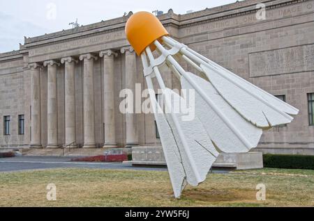 One of four giant shuttlecocks on the grounds of the Nelson Adkins Museum of Art overlook the Kansas City, Missouri skyline. Stock Photo