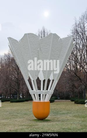 One of four giant shuttlecocks on the grounds of the Nelson Adkins Museum of Art overlook the Kansas City, Missouri skyline. Stock Photo