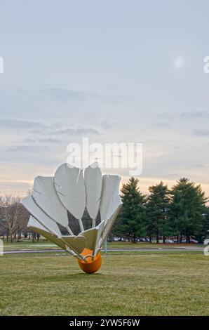 One of four giant shuttlecocks on the grounds of the Nelson Adkins Museum of Art overlook the Kansas City, Missouri skyline. Stock Photo