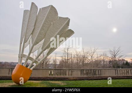One of four giant shuttlecocks on the grounds of the Nelson Adkins Museum of Art overlook the Kansas City, Missouri skyline. Stock Photo