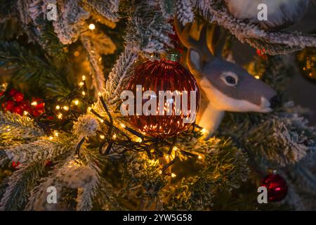 Detail of christmas decorations in tree ornaments. Stock Photo