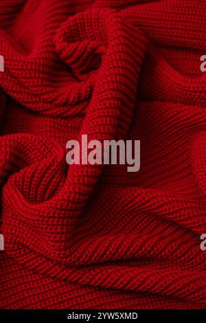 Red sweater texture as a background. Top view Stock Photo