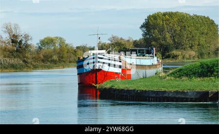 Champagne, France - October 16th 2024 - Old riverboat moored alongside the riverbank with no one around Stock Photo