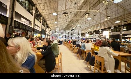 Lisbon, Portugal - November 22 2021: Interior view of the Time Out Market Lisboa, a trendy food hall located in the Mercado da Ribeira at Cais do Sodr Stock Photo