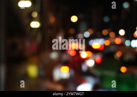 Blur bokeh of traffic light and car on the road. Stock Photo