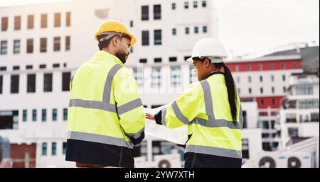 People, planning and paper in city for engineering, urban development and project management. Contractor, supervisor and outdoor with blueprint for Stock Photo