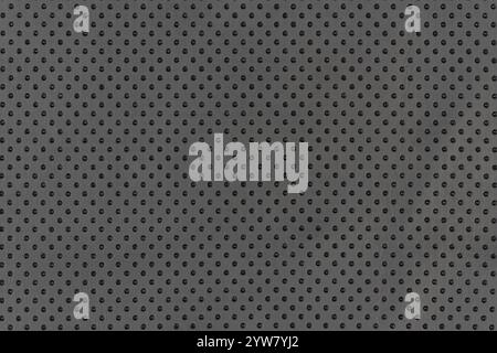 Black color abstract matte material fabric smooth surface with small dots and holes breathable pattern for background. Closeup view of blackish color Stock Photo
