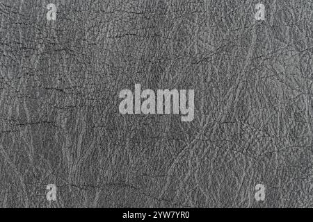 Dark gray color abstract unique faux leather pattern for background. Close-up top view photography of light black color surface level artificial leath Stock Photo