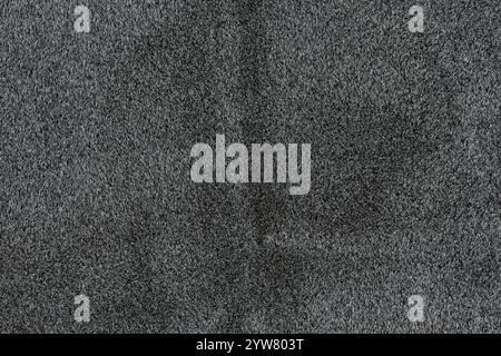 Black colored abstract faux fur pattern for designing element. Close-up photo from shadow, dark color, surface, fake fur material, background Stock Photo