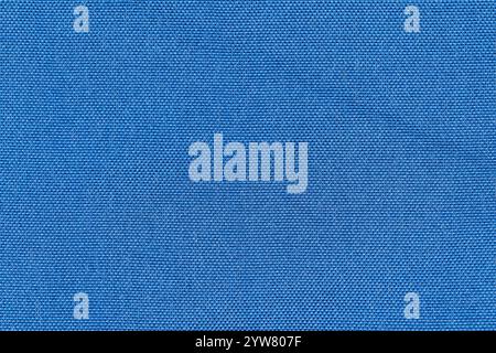 Blue color woven hand abstract fabric pattern for background. Close-up of plain blue surface level textile material, colored background cloth texture Stock Photo