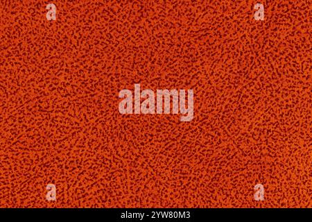 Red fabric material with short pile fluffy and soft texture background. Close-up detail photography top view of orange colour surface cloth material Stock Photo