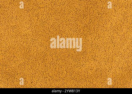 Yellow color fabric material with short haired fluffy and soft texture background. Close-up of yellowish colour surface textile material, background f Stock Photo