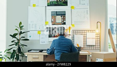 Back, woman or idea in office for architecture, design process or blueprint for housing development. Mature engineer, moodboard or creative at desk Stock Photo