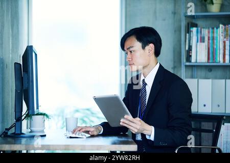 Businessmen working in an office Stock Photo