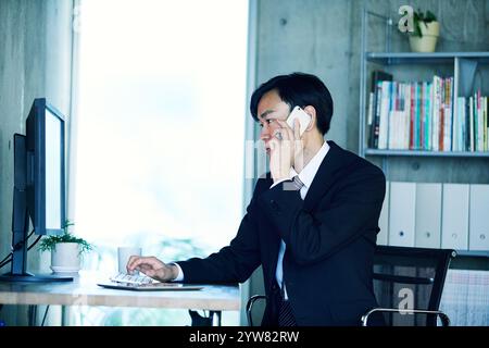 Businessmen working in an office Stock Photo
