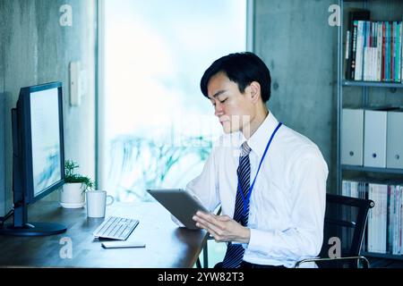 Businessmen working in an office Stock Photo
