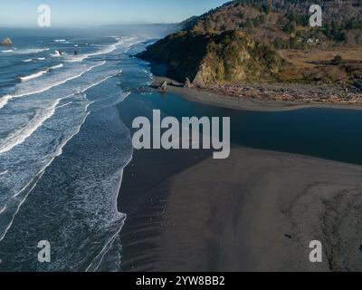 The scenic and wild landscape of Humboldt County in Northern California, USA. Seen from above, a birds eye aerial view. River flows into the ocean. Stock Photo