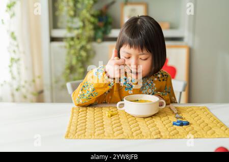 Girl having breakfast Stock Photo