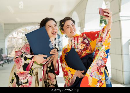 Graduation ceremony College students taking photos at graduation ceremony Stock Photo