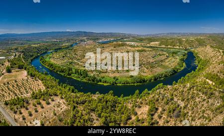 Aerial view of the Flix meander, where the Ebro river forms a huge meander around the castle and village of Flix (Tarragona, Catalonia, Spain) Stock Photo