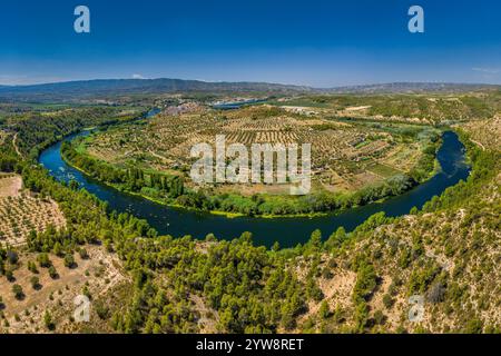 Aerial view of the Flix meander, where the Ebro river forms a huge meander around the castle and village of Flix (Tarragona, Catalonia, Spain) Stock Photo