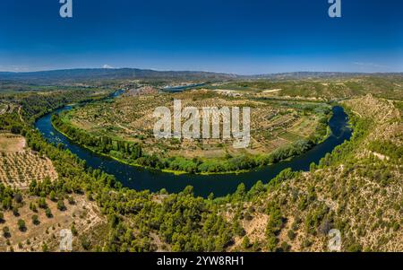 Aerial view of the Flix meander, where the Ebro river forms a huge meander around the castle and village of Flix (Tarragona, Catalonia, Spain) Stock Photo