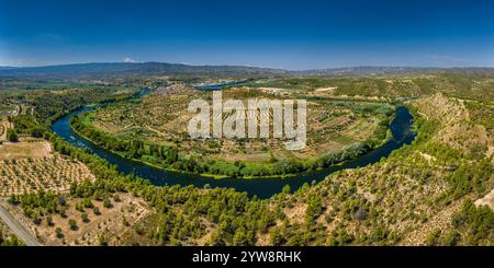 Aerial view of the Flix meander, where the Ebro river forms a huge meander around the castle and village of Flix (Tarragona, Catalonia, Spain) Stock Photo