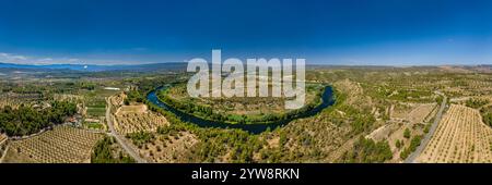 Aerial view of the Flix meander, where the Ebro river forms a huge meander around the castle and village of Flix (Tarragona, Catalonia, Spain) Stock Photo