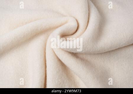 Beige sweater texture as a background. Top view. Stock Photo