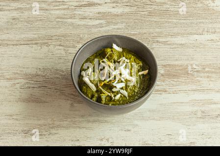 Palak paneer is a type of Saag, which can also be made from mustard leaves. The difference between Palak paneer and Saag paneer is the consistency, as Stock Photo