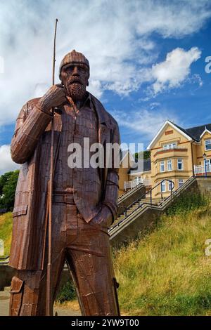 UK, North Yorkshire, Filey, The Promenade, 'A High Tide In Short Wellies' Sculpture. Stock Photo
