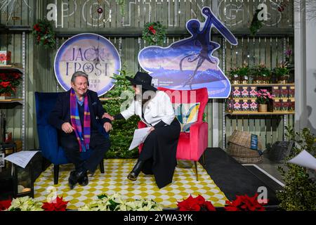 Wisley, UK, 9th December 2024, Gardener, writer and RHS Ambassador Alan Titchmarsh and composer Debbie Wiseman celebrate the unique musical collaboration between ‘Jack Frost – A Winter Story’ and RHS Garden Wisley’s dazzling festive illuminations – RHS Glow., Andrew Lalchan Photography/Alamy Live News Stock Photo