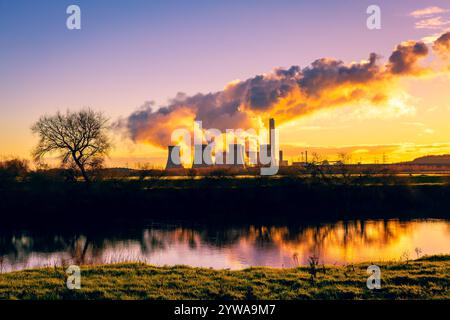 Drax Power in Winter with large plumes of water vapour rising from the cooling towers and reflections in the River Ouse near Hemingbrough, Selby. UK. Stock Photo