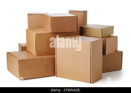 Stacked brown cardboard boxes in various sizes arranged on a white background Stock Photo