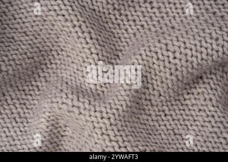 Grey wool sweater texture as a background. Top view. Stock Photo