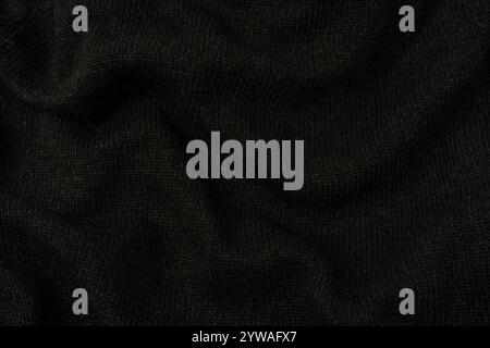 Dark grey sweater texture as a background. Knitted pattern. Top view. Stock Photo