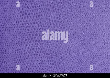 Cloth structure of  jacquard purple fabric with abstract shabby spotted embossed texture closeup, macro. Upholstery, decorative cloth structure, home Stock Photo