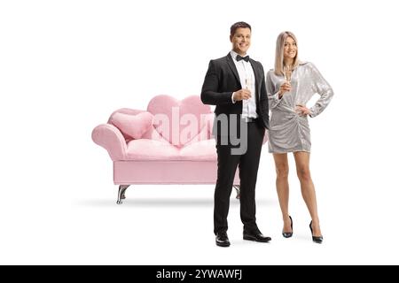 Couple holding glasses of sparkling wine isolated on white background Stock Photo