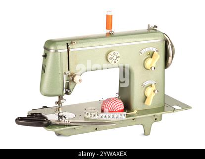 Sewing machine, measuring tape, scissors, pincushion and spool of thread isolated on white Stock Photo