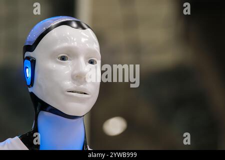 Close-up of a humanoid robot with glowing blue features, showcasing modern technology and artificial intelligence. Stock Photo