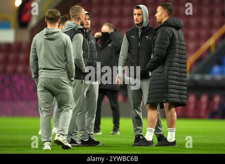 Derby County's Jerry Yates (second right) and team-mates inspect the pitch before the Sky Bet Championship match at Turf Moor, Burnley. Picture date: Tuesday December 10, 2024. Stock Photo