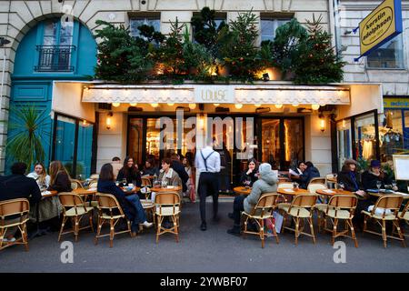 Paris, France-November 30, 2024 : The traditional French cafe Louise decorated for Christmas 2024 . It located near Saint Germain boulevard in Paris, Stock Photo