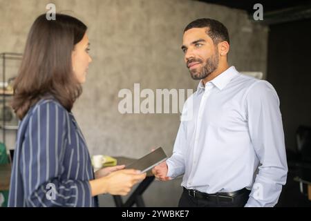 Effective teamwork in a diverse corporate environment fosters success Stock Photo