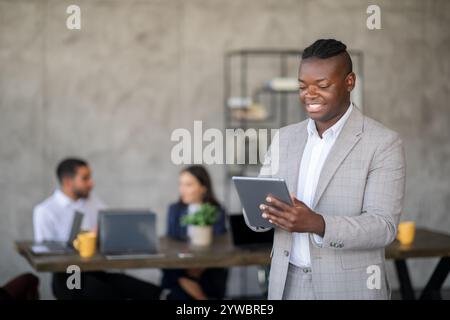 Diverse business team collaborating in modern office environment Stock Photo